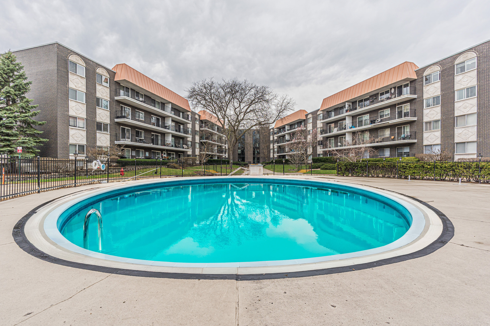 4901 Golf Road, Unit 410 Skokie, IL 60077 - Photo 26 of 26 a view of outdoor space swimming pool and seating