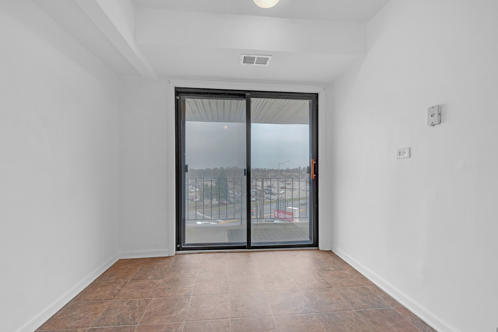 4901 Golf Road, Unit 410 Skokie, IL 60077 - Photo 9 of 26 a view of an empty room with window