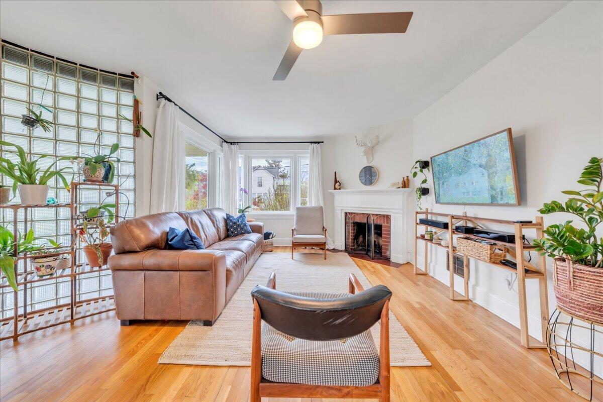 5120 Starkey Road Roanoke, VA 24018 - Photo 11 of 43 a living room with furniture a fireplace and a floor to ceiling window