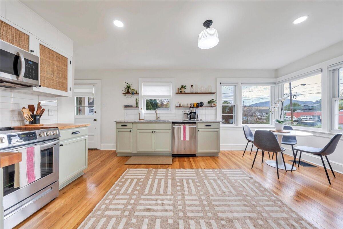 5120 Starkey Road Roanoke, VA 24018 - Photo 12 of 43 a living room with stainless steel appliances granite countertop furniture wooden floor and a large window