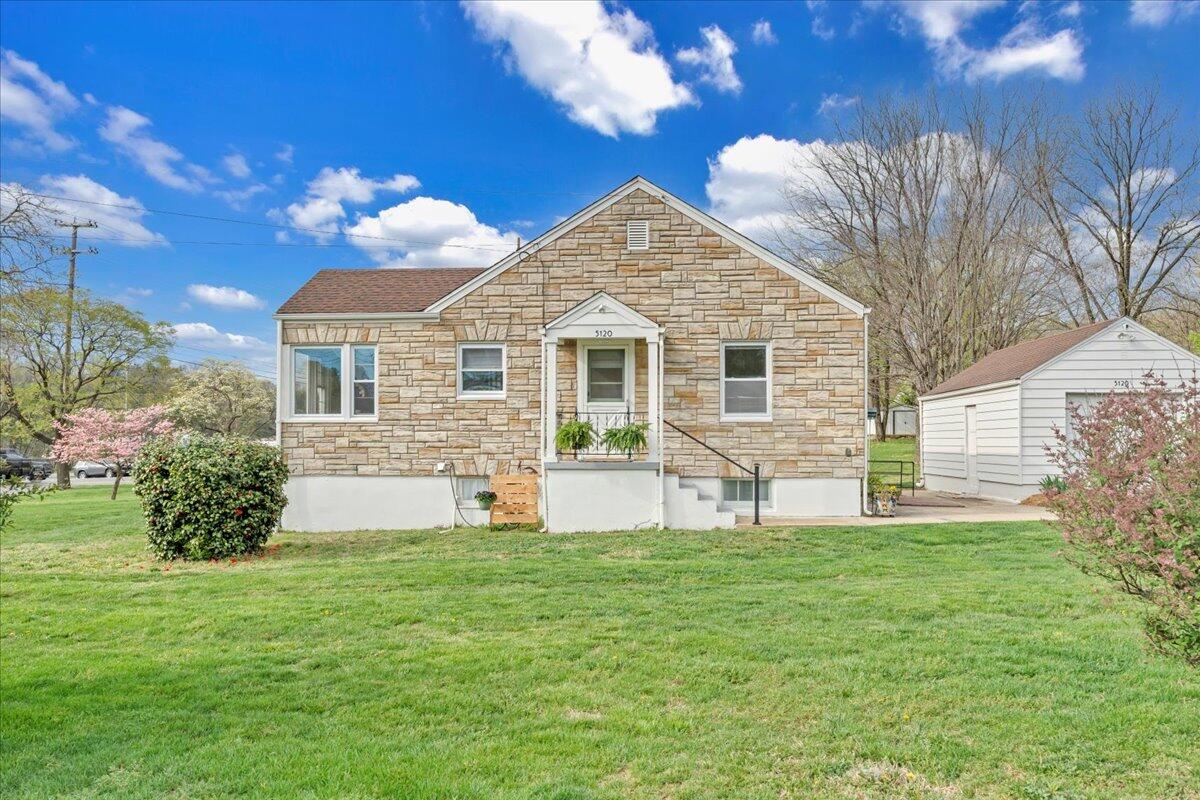 5120 Starkey Road Roanoke, VA 24018 - Photo 2 of 43 a front view of a house with a garden and yard