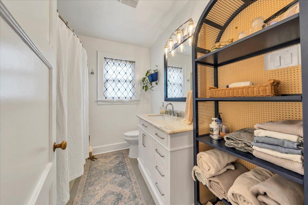 5120 Starkey Road Roanoke, VA 24018 - Photo 22 of 43 a bathroom with a granite countertop sink and a large mirror