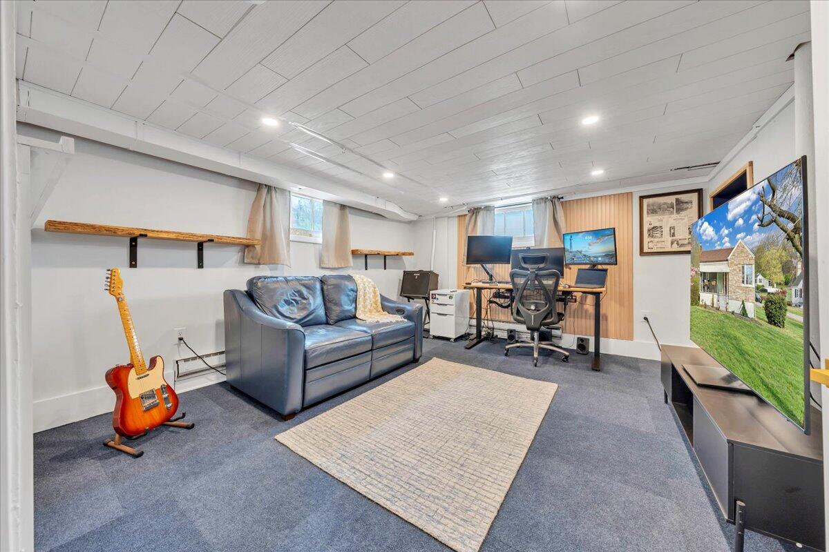 5120 Starkey Road Roanoke, VA 24018 - Photo 25 of 43 a living room with furniture and a flat screen tv