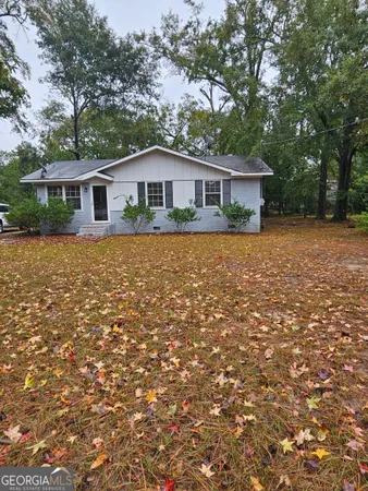 a front view of a house with yard
