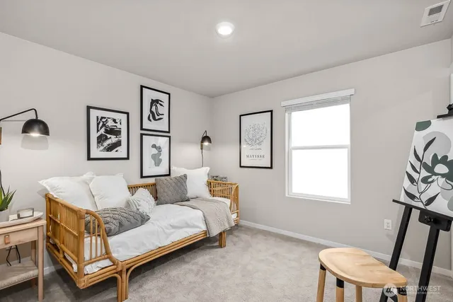 a bedroom with furniture and a window