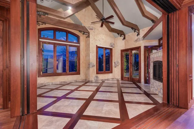 a kitchen with stainless steel appliances granite countertop a stove and a wooden floors