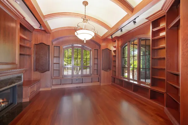 a view of an empty room with a fireplace