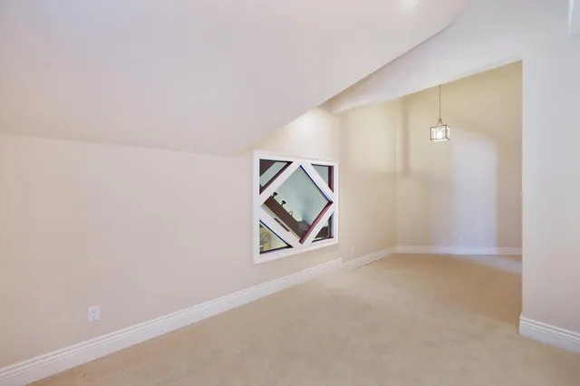 a view of a garden with an outdoor seating