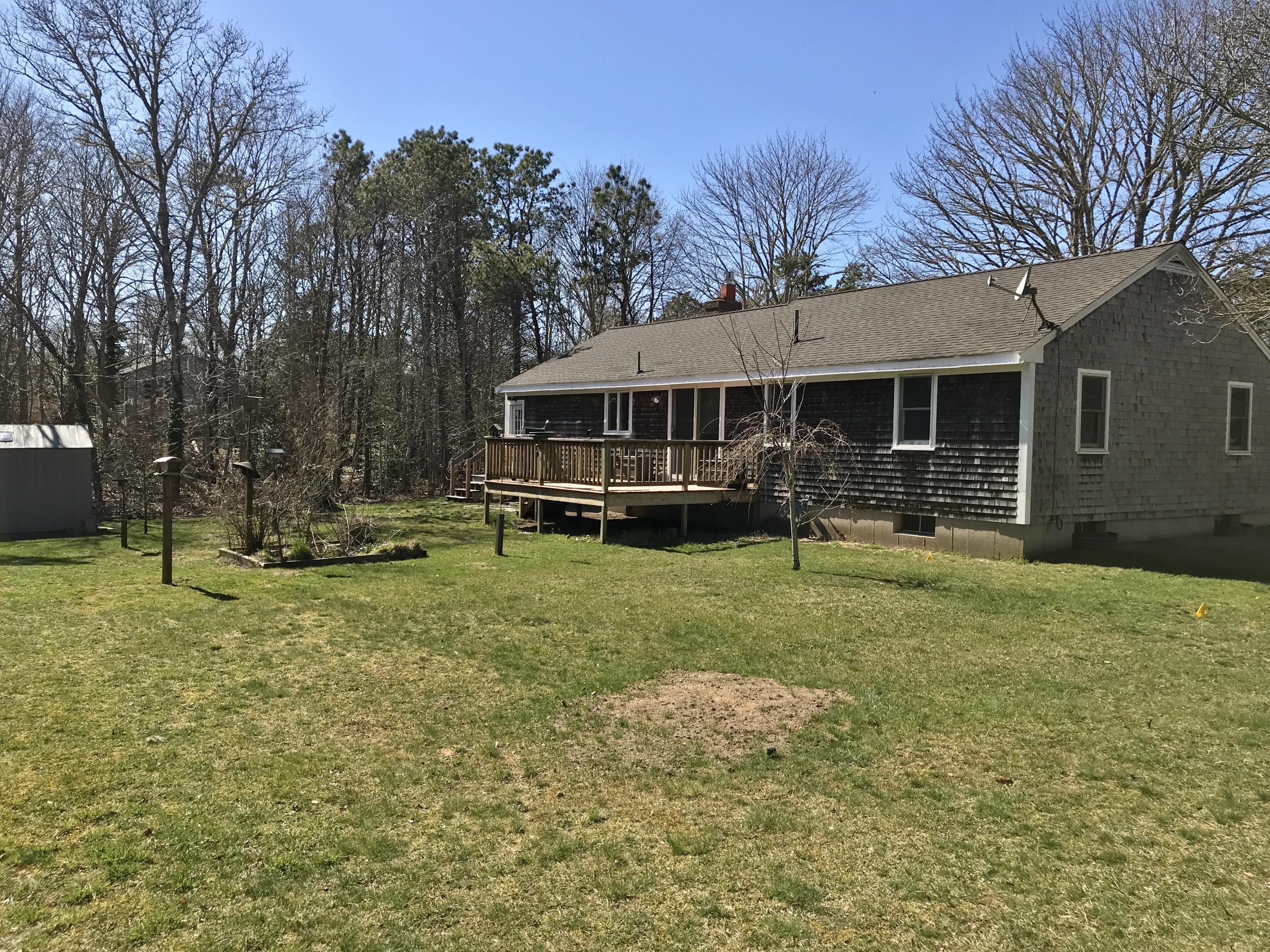 67 Long Road Harwich, MA 02645 - Photo 2 of 30 a front view of house with yard and green space