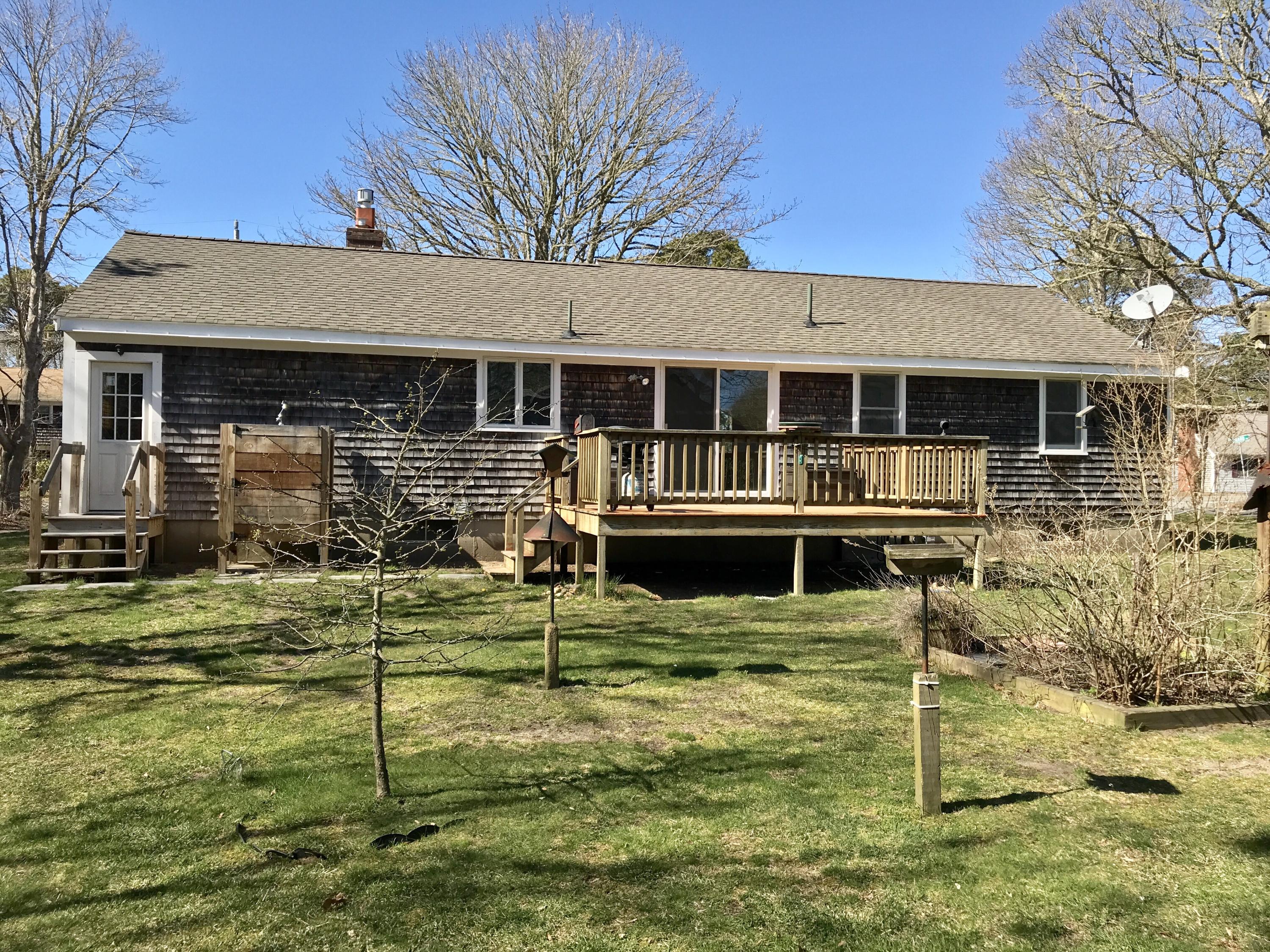 67 Long Road Harwich, MA 02645 - Photo 23 of 30 front view of a house with a yard