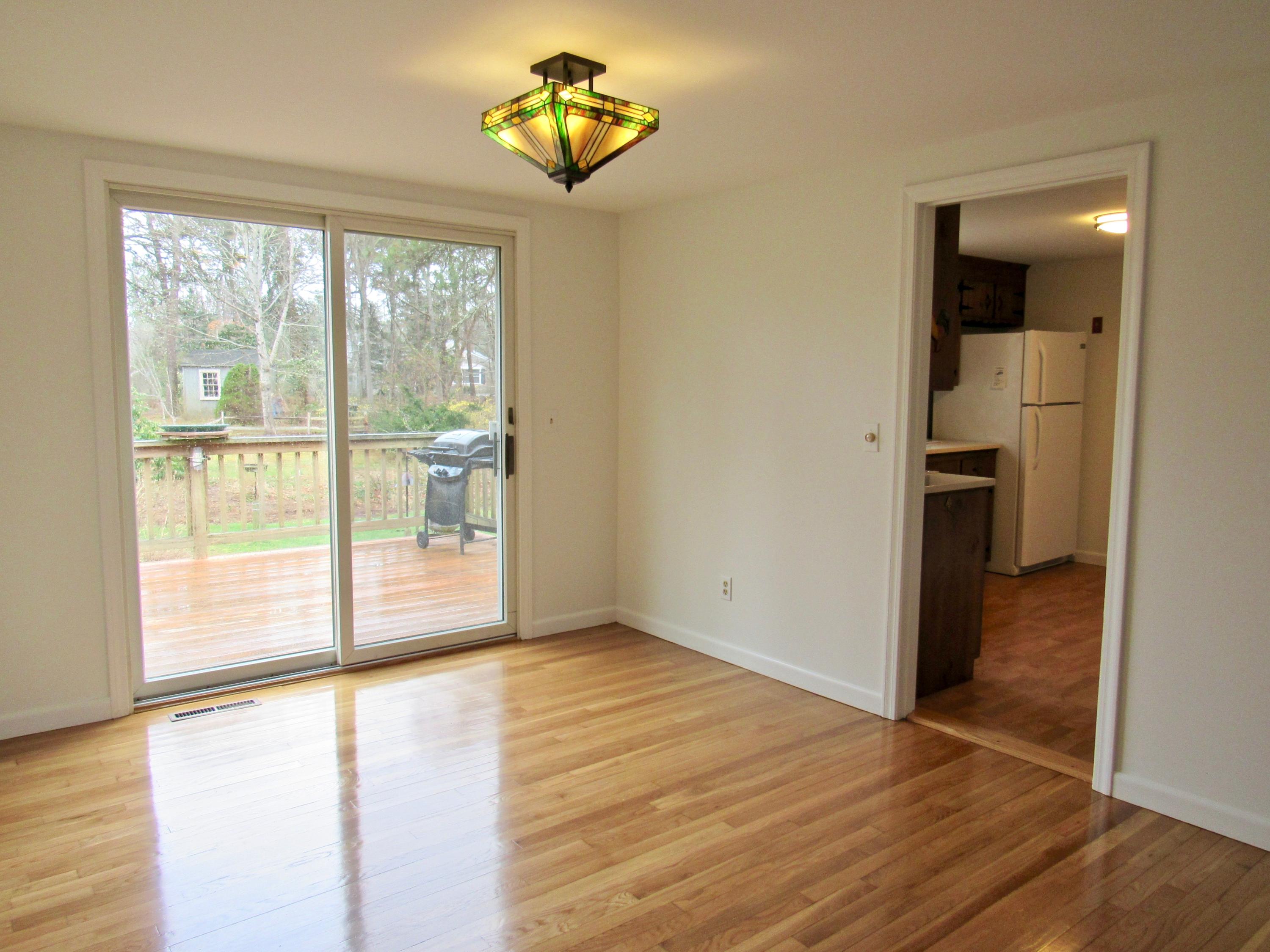 67 Long Road Harwich, MA 02645 - Photo 8 of 30 wooden floor in an empty room with a window