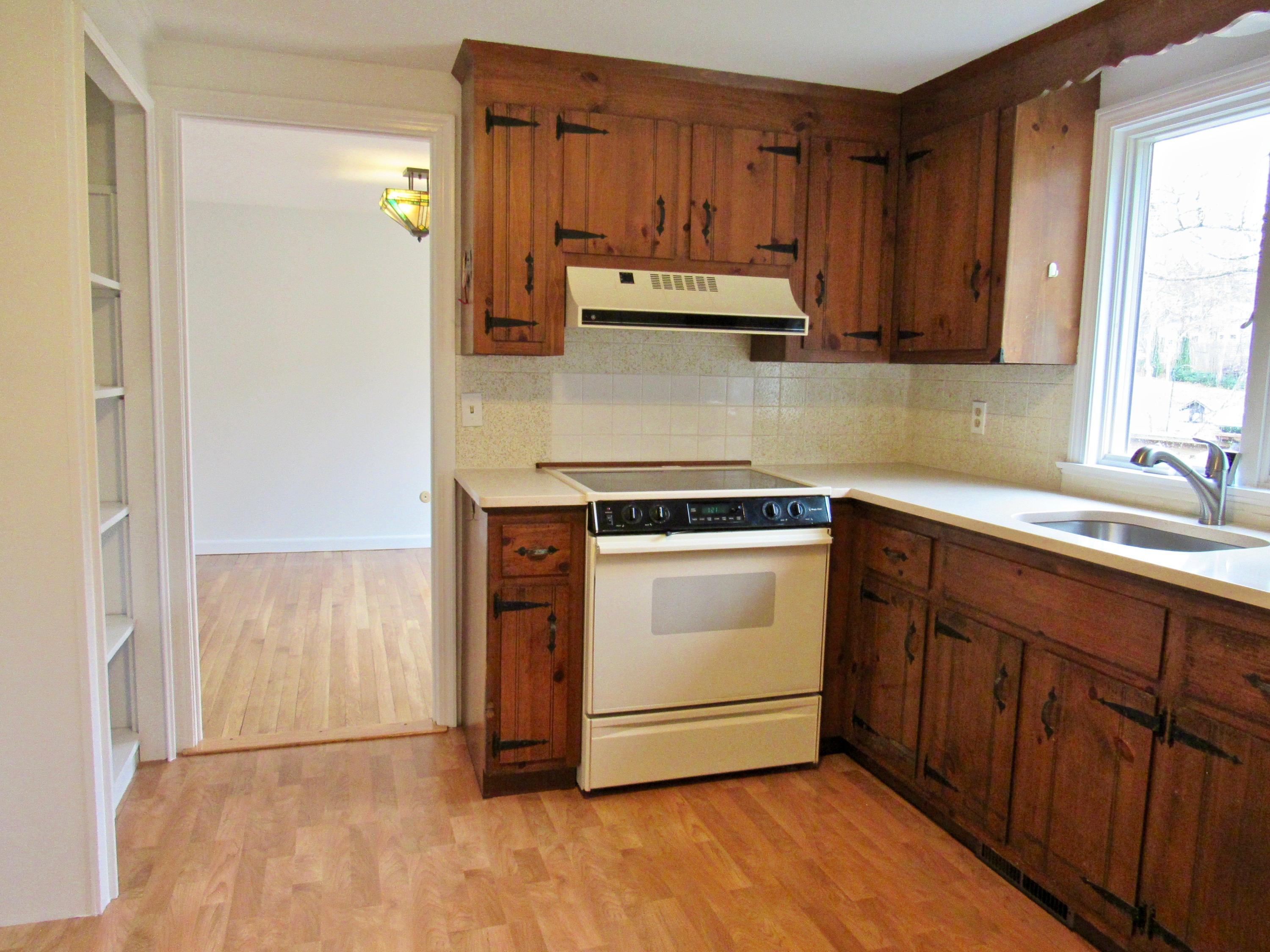 67 Long Road Harwich, MA 02645 - Photo 10 of 30 a kitchen with a sink cabinets and a window