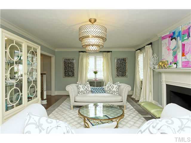 1501 Canterbury Road Raleigh, NC 27608 - Photo 3 of 25 a living room with furniture and a fireplace