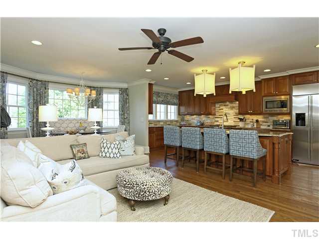 1501 Canterbury Road Raleigh, NC 27608 - Photo 6 of 25 a living room with furniture kitchen view and a wooden floor