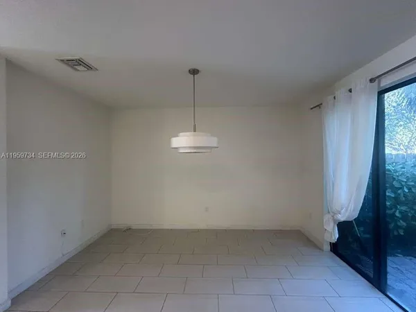 a view of a room with a sink and a window
