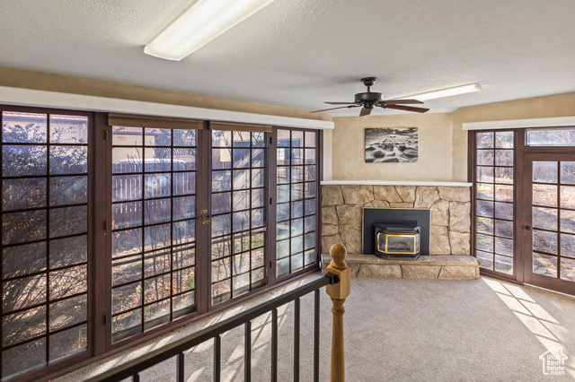 465 North Main Street Richfield, UT 84701 - Photo 27 of 43 Living room featuring a wealth of natural light, a textured ceiling, and carpet