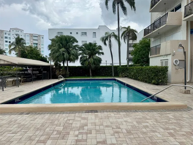 a bedroom with three beds and window