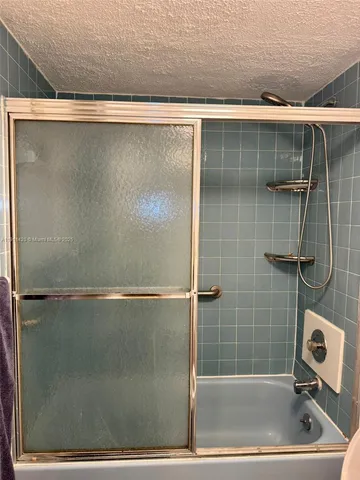 a kitchen with stainless steel appliances granite countertop a stove microwave and cabinets