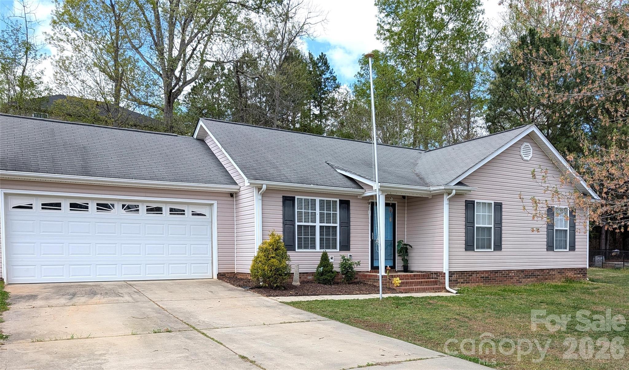 505 Azure Avenue Albemarle, NC 28001 - Photo 3 of 20 a front view of a house with a garden
