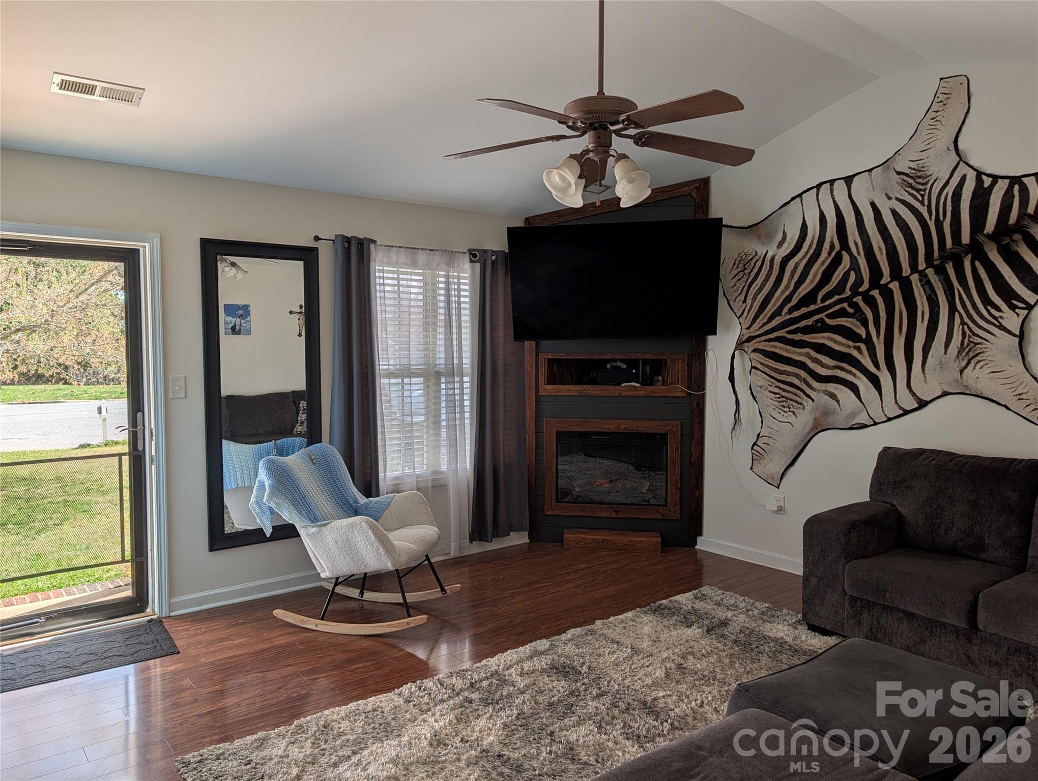 505 Azure Avenue Albemarle, NC 28001 - Photo 6 of 20 a living room with furniture a flat screen tv and a fireplace