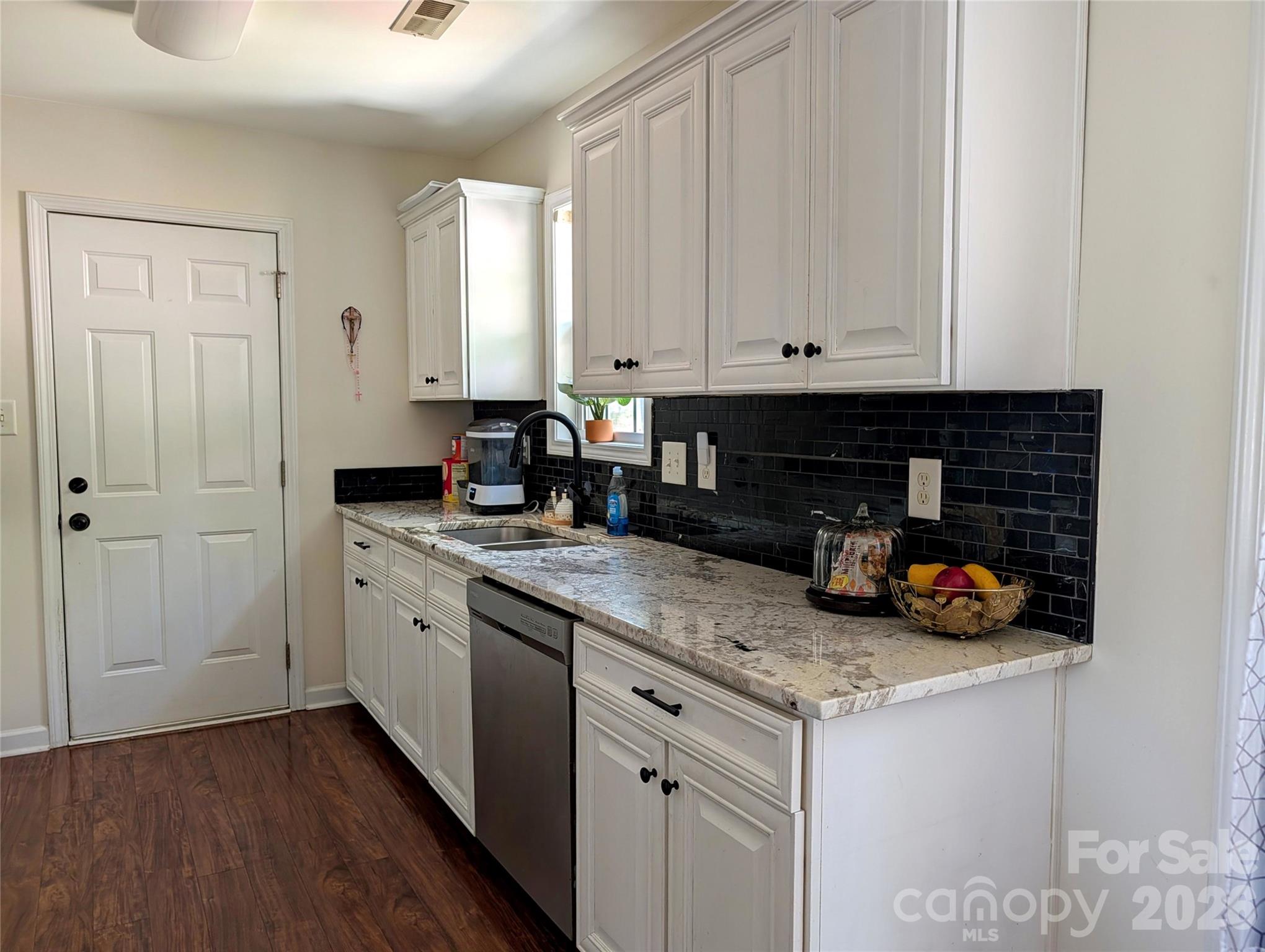 505 Azure Avenue Albemarle, NC 28001 - Photo 9 of 20 a kitchen with stainless steel appliances granite countertop a sink and cabinets