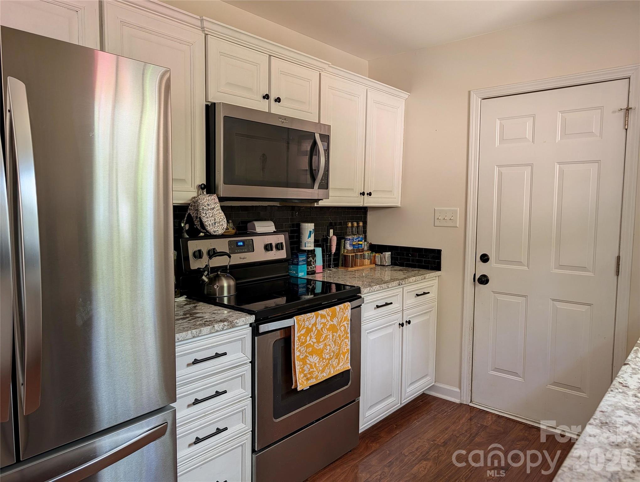505 Azure Avenue Albemarle, NC 28001 - Photo 10 of 20 a kitchen with stainless steel appliances a stove and a refrigerator