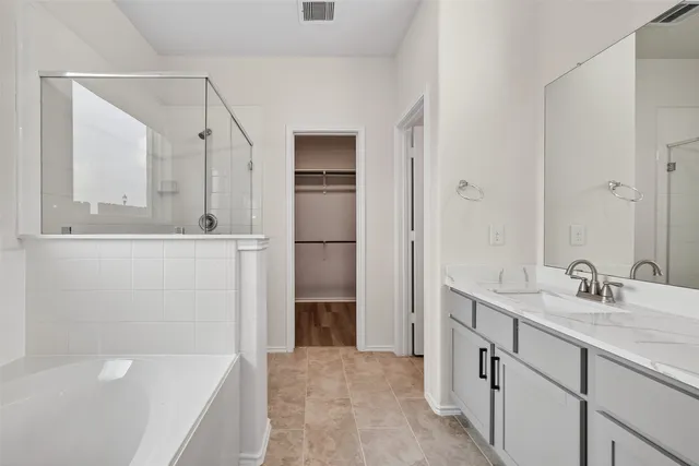 a view of a refrigerator with wooden floor