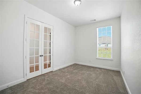 an empty room with windows