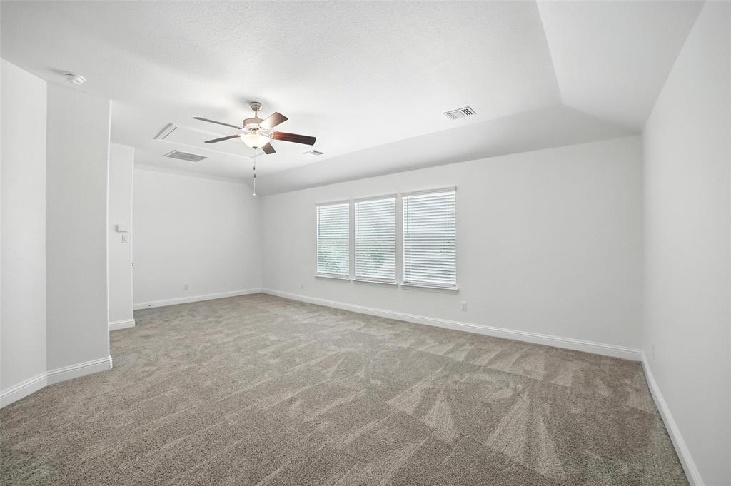 2616 Morning Mist Lane Nevada, TX 75173 - Photo 15 of 16 a view of an empty room with a ceiling fan