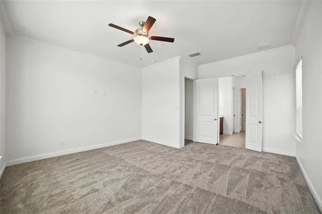 a view of a big room with carpet