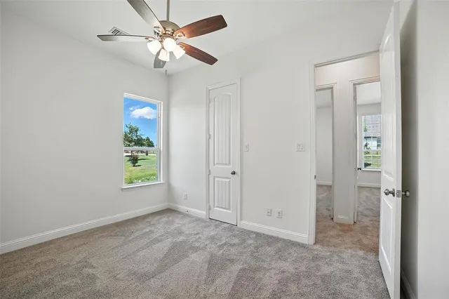 wooden floor in an empty room and a window