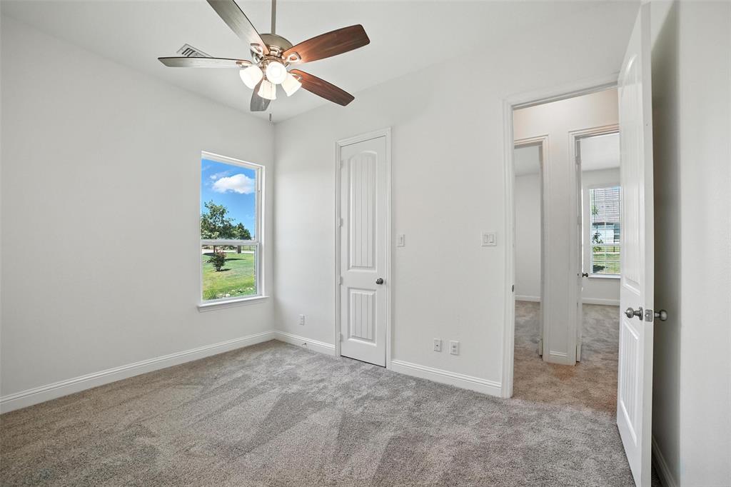 2616 Morning Mist Lane Nevada, TX 75173 - Photo 9 of 16 wooden floor in an empty room and a window
