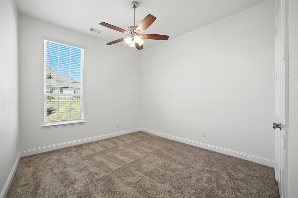 2616 Morning Mist Lane Nevada, TX 75173 - Photo 10 of 16 an empty room with windows and fan