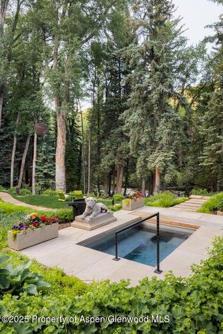a view of a patio with a table and chairs