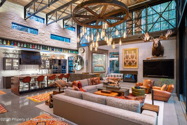 a outdoor living space with patio furniture and a fireplace