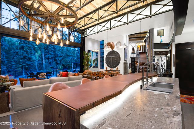 a view of a couches and dinning table in the patio
