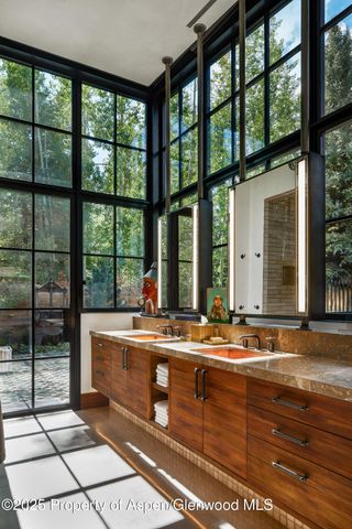 a room with furniture and large window