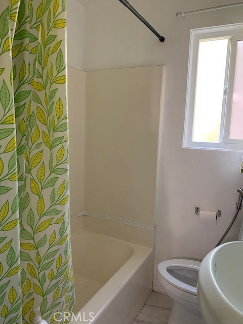 7161 Main Street Westminster, CA 92683 - Photo 12 of 21 a bath room with a toilet and a bath tub