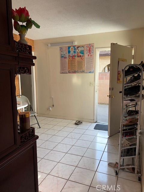 7161 Main Street Westminster, CA 92683 - Photo 15 of 21 a view of walk in closet with clothes and shoes