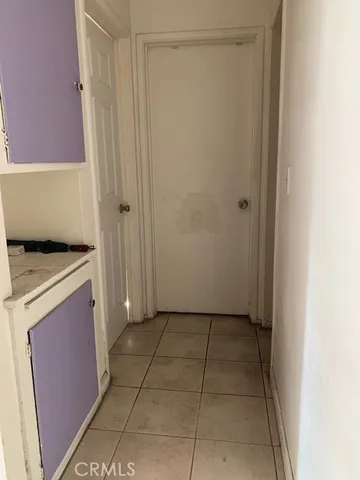 a bathroom with a toilet and a shower curtain