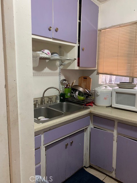 7161 Main Street Westminster, CA 92683 - Photo 17 of 21 a kitchen with stainless steel appliances granite countertop a sink a stove and cabinets