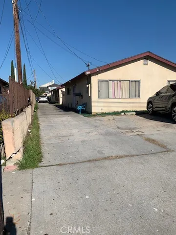 a view of a house with a road