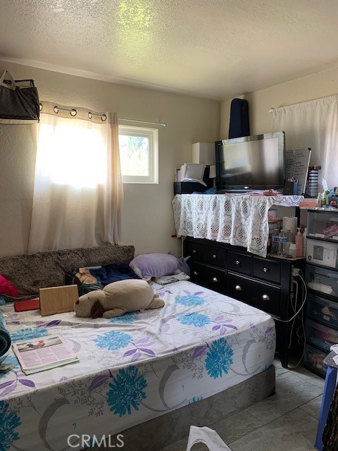 7161 Main Street Westminster, CA 92683 - Photo 10 of 21 a bedroom with a bed and wooden floor