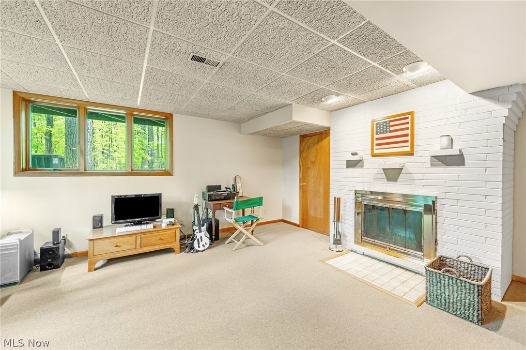 4587 Ranchwood Road Akron, OH 44333 - Photo 33 of 44 Large windows in the Lower Level Family Room bring in lovely natural light.
