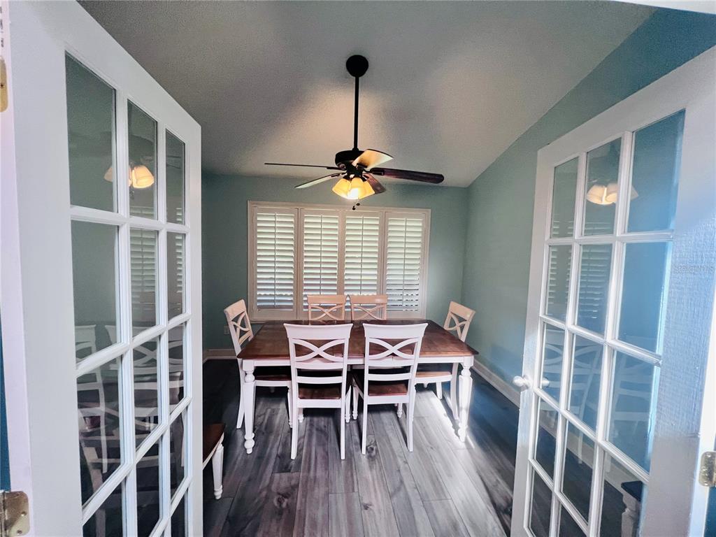 357 Tymber Run Ormond Beach, FL 32174 - Photo 12 of 32 a view of a dining room with furniture and wooden floor