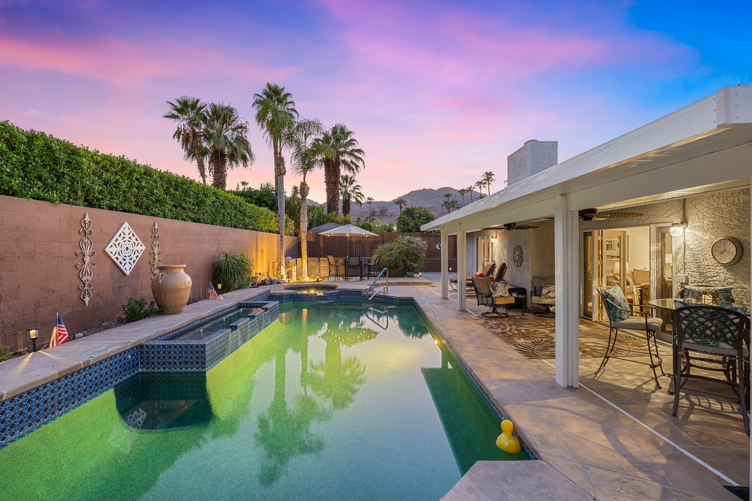 72733 Haystack Road Palm Desert, CA 92260 - Photo 40 of 60 a view of a swimming pool with chairs