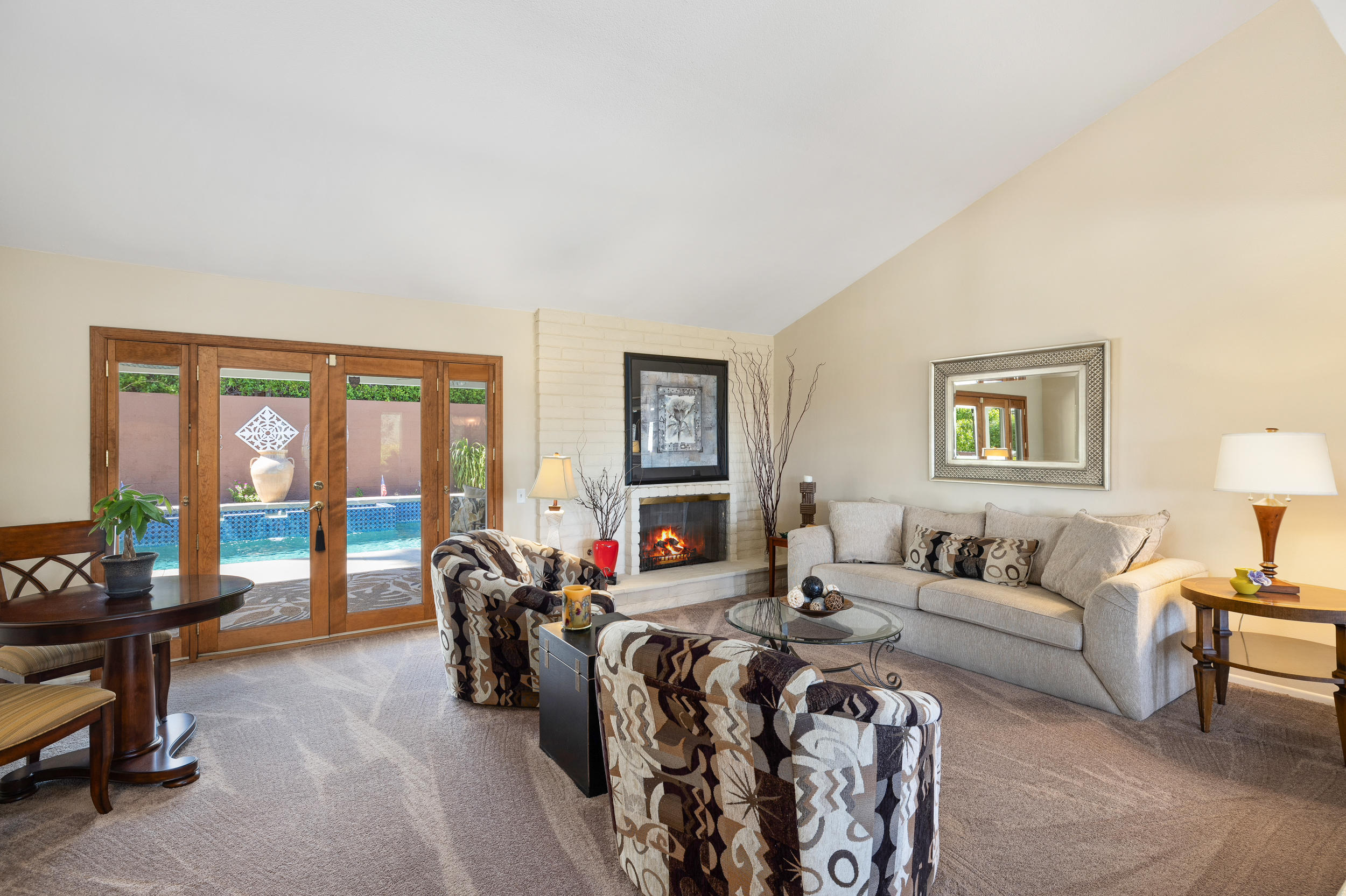 72733 Haystack Road Palm Desert, CA 92260 - Photo 8 of 60 a living room with furniture and a lamp