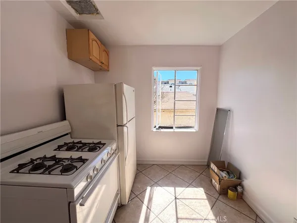 a kitchen with a stove and a microwave