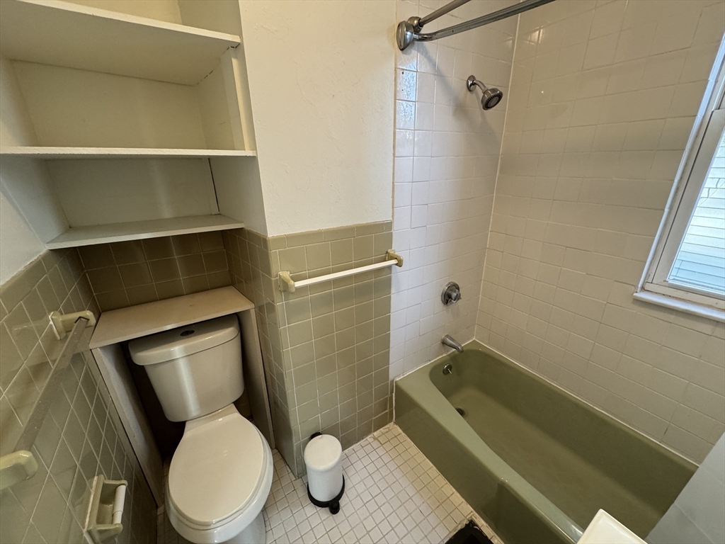 377 Highland Avenue, Unit 1 Somerville, MA 02144 - Photo 18 of 25 a bathroom with a toilet and a shower