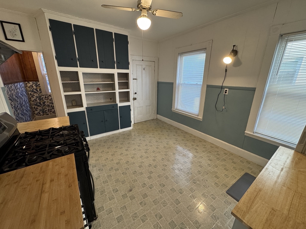 377 Highland Avenue, Unit 1 Somerville, MA 02144 - Photo 5 of 25 a view of a livingroom with a staircase